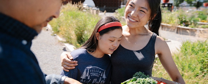 Mom and daughter in a garden