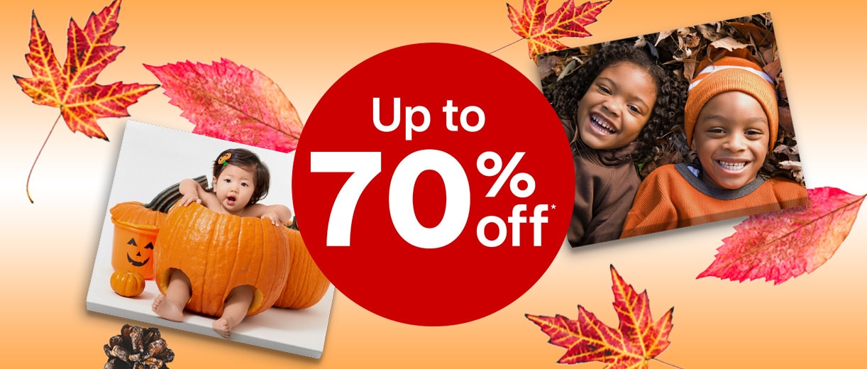 Canvas print of a toddler inside a pumpkin and two siblings lying in the leaves, smiling, against a fall background. Up to 70% off.