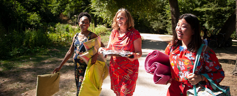 Three ladies walking outside in the sun