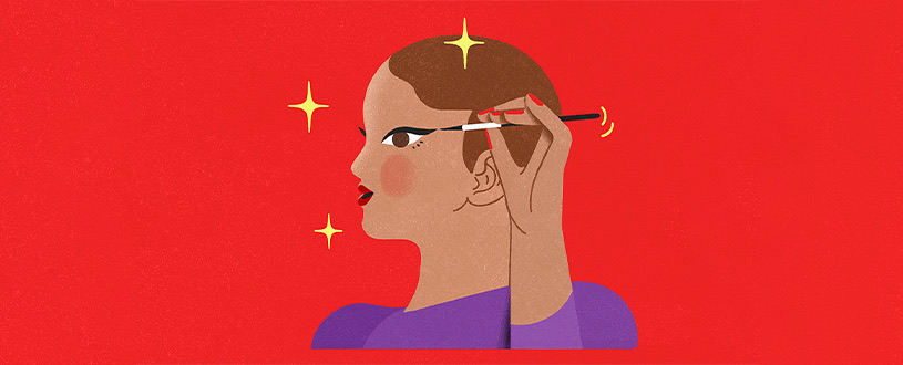 Woman putting on eyeliner