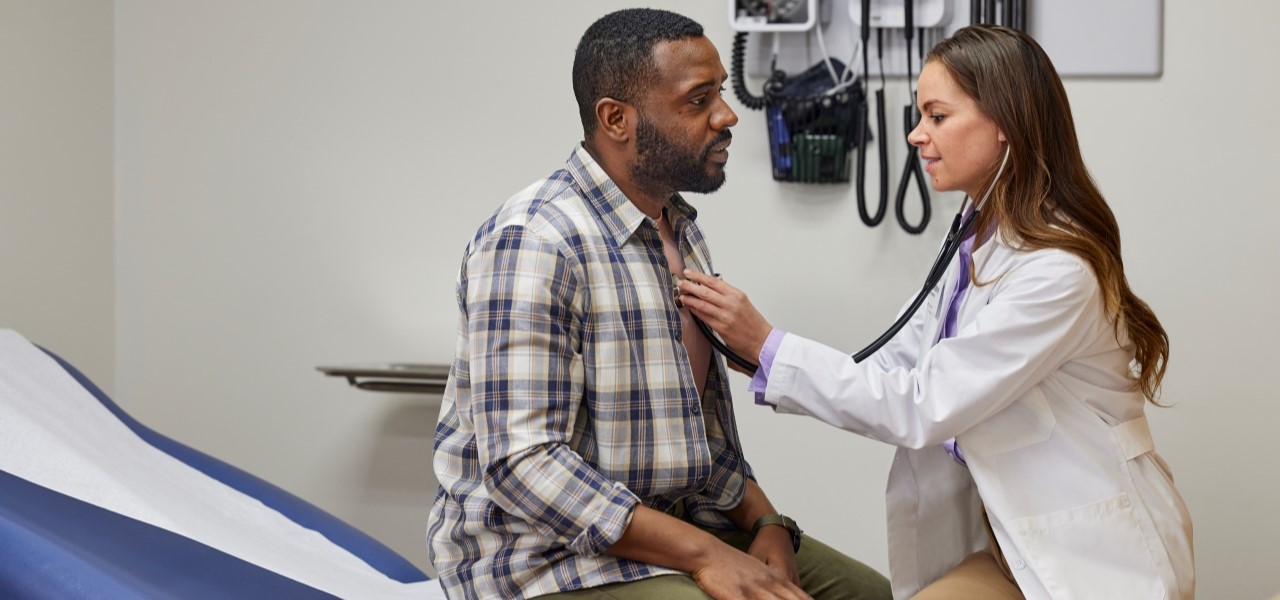 MinuteClinic at CVS and practitioner checking a patient's vital signs