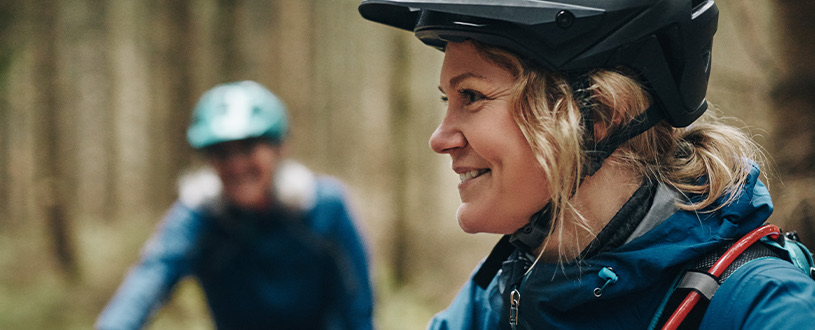 Woman on a bike ride wearing helmet