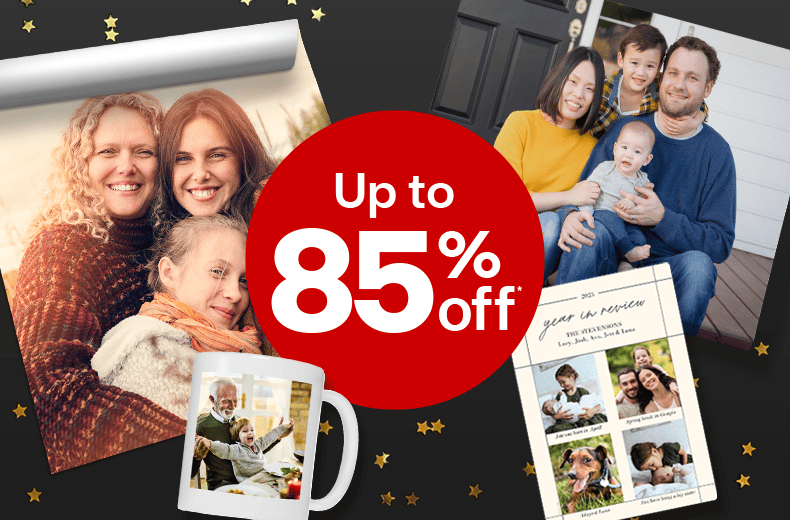Holiday sale offer dot showing ‘Up to 85% off’ with festive family photos, cards and decorations.