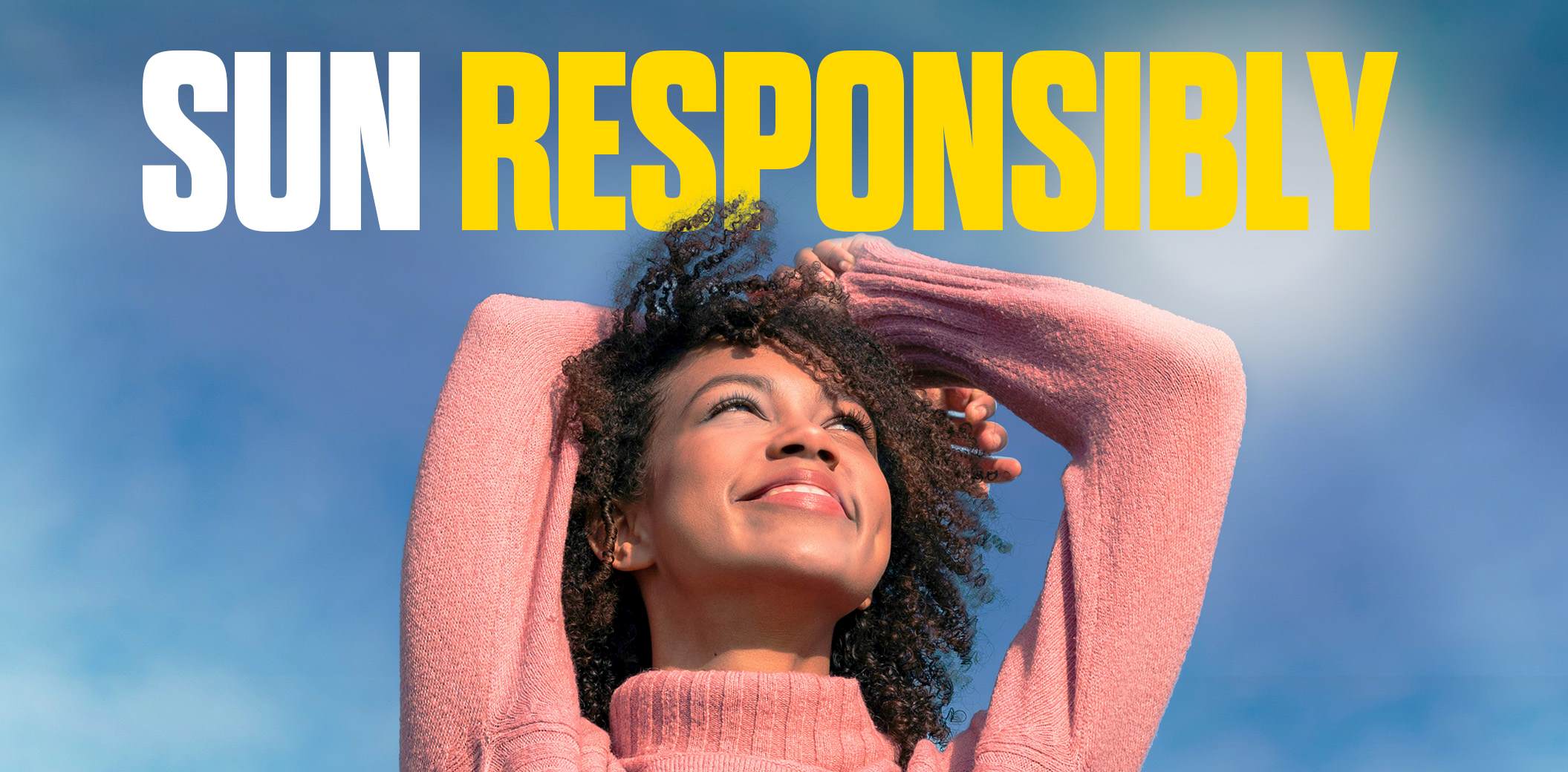 Sun responsibly. Woman lifting her hands above her head.