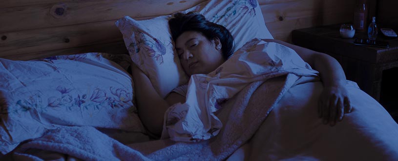 Woman asleep in bed