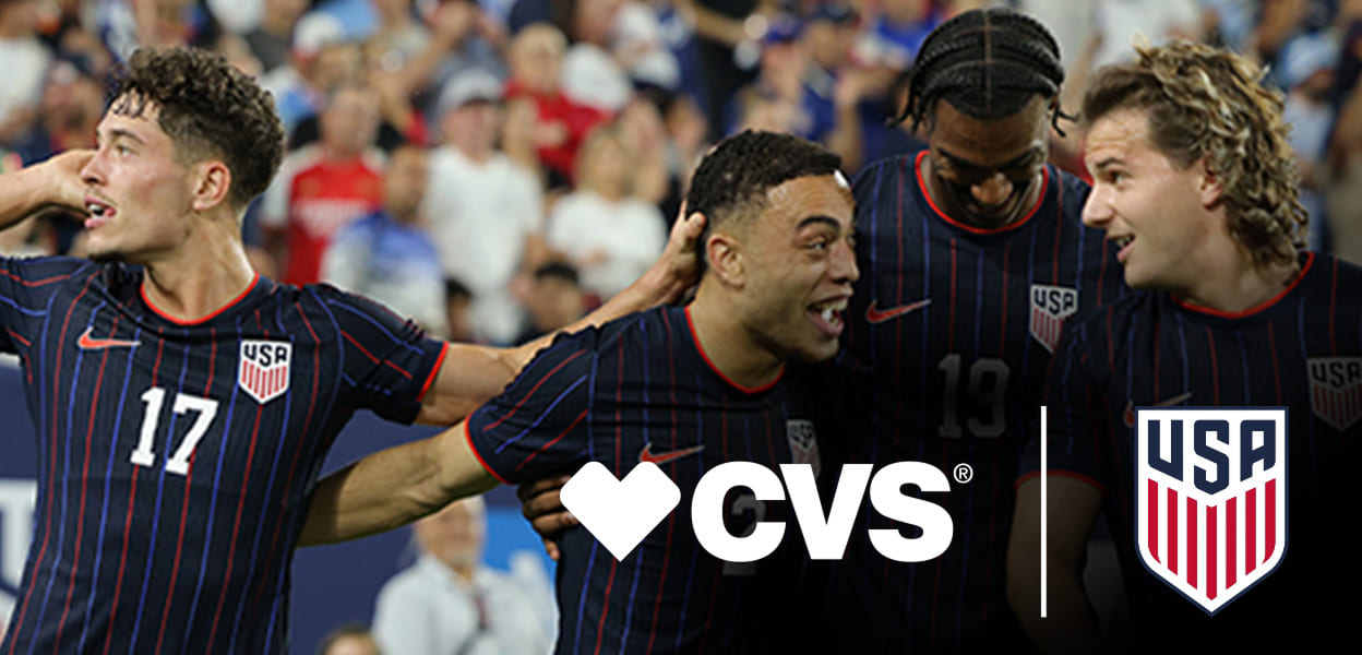Four members of the men’s U.S. Soccer team celebrate a goal. CVS logo and U.S. Soccer logo are featured at the bottom right of image.