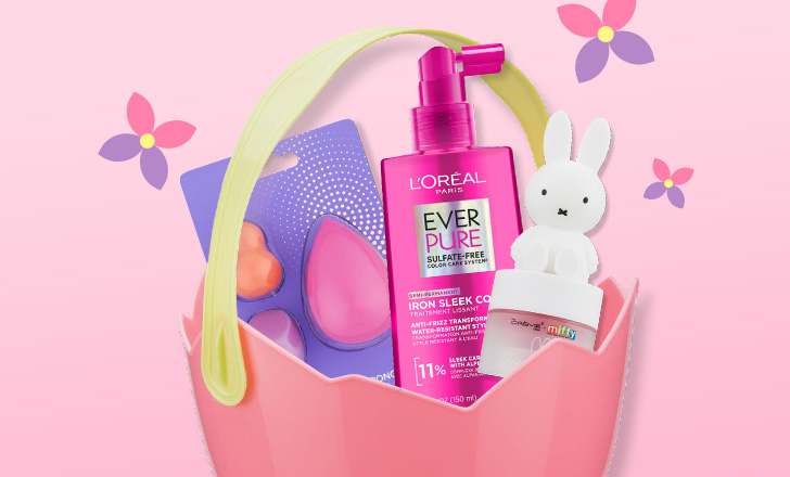 Pink Easter egg basket with beauty blenders, L'Oréal Ever Pure conditioner and a Miffy bunny against a pink background with purple and pink flowers