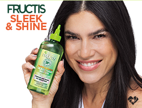 Image of happy girl holding Garnier product