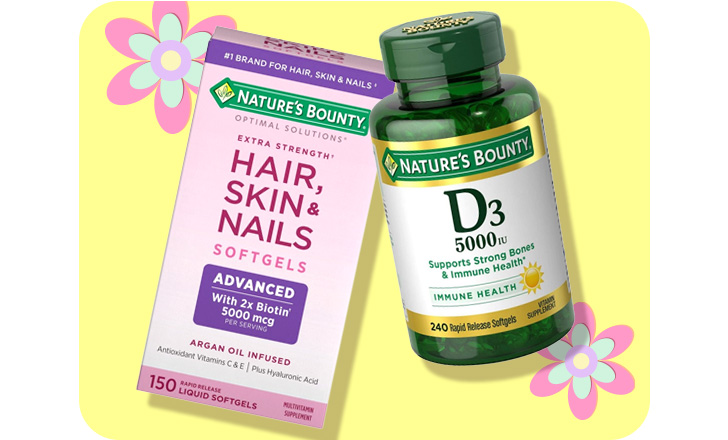 Nature's Bounty Hair, Skin & Nails softgels and D3 softgels against a yellow background and pastel-colored flowers.