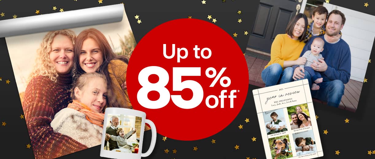 Holiday sale offer dot showing ‘Up to 85% off’ with festive family photos, cards and decorations.