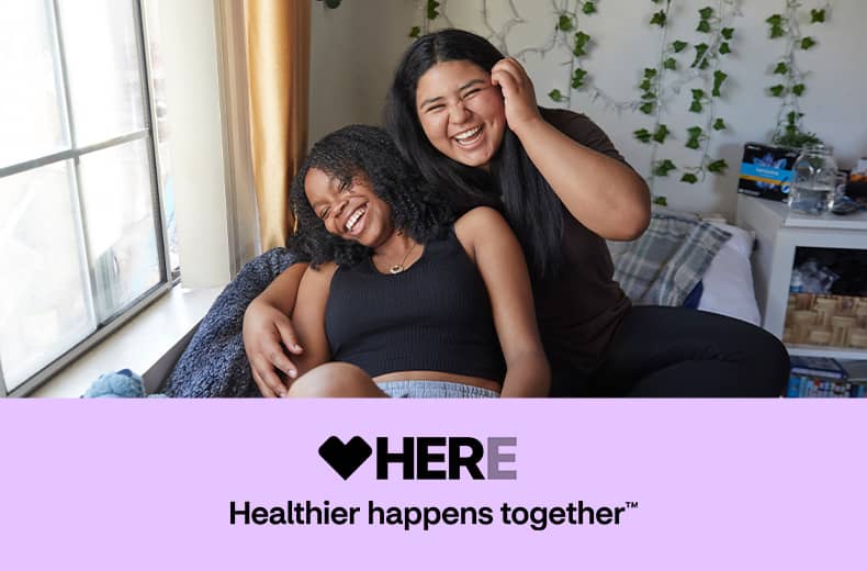 Here, healthier happens together. Two women laughing together.
