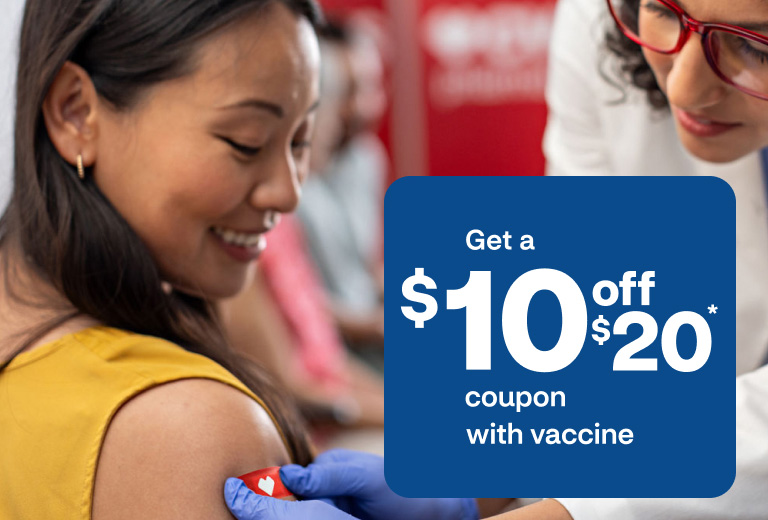 A patient is happy to get a bandage placed on their arm after a successful vaccination.