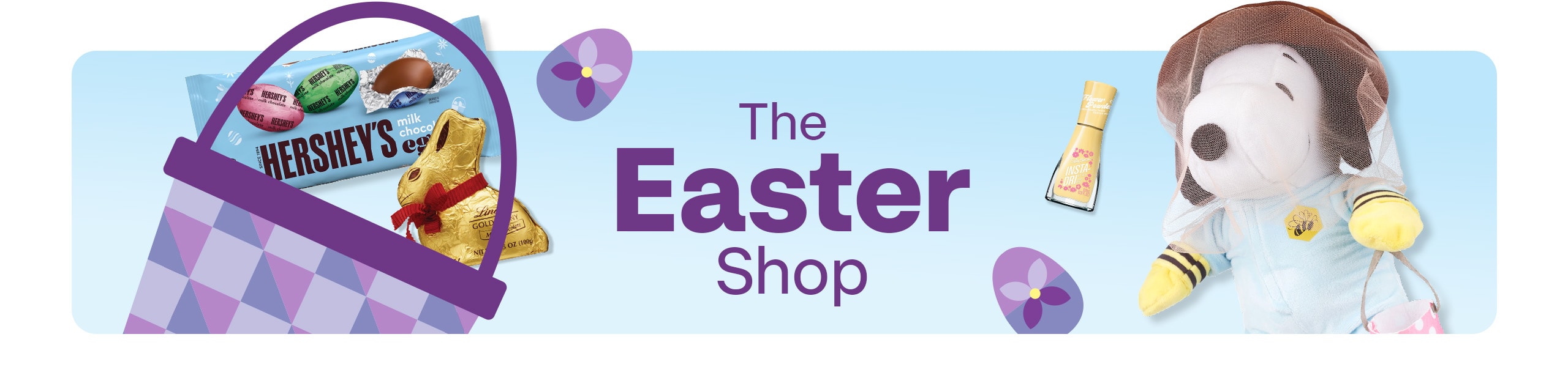 The Easter shop. Snoopy plush doll, yellow nail polish, purple Easter basket with Hershey’s chocolate bar and Lindt Gold Bunny with purple Easter eggs against a blue background